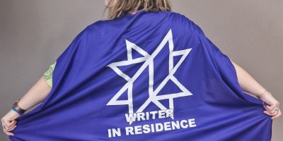 Lisette wearing her Writer In Residence cape